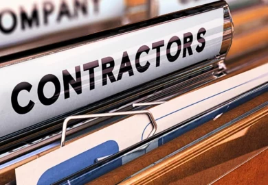 A brown contractor file with different other files on the background.