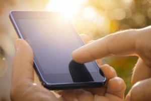 person tracking their health on their cell phone.