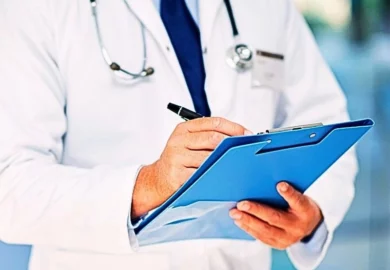 Doctor writing notes in a folder