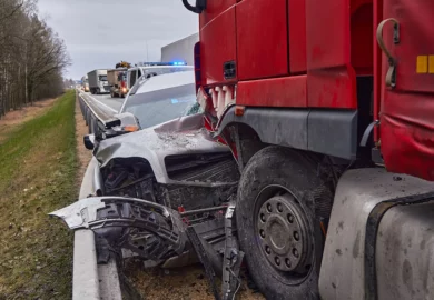 Truck and car collision in a freeway.