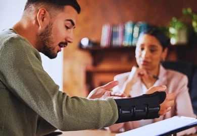 Injury or man with lawyer woman planning on documents for insurance. Can I reopen a car accident case