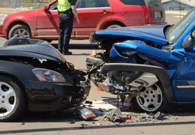 Head on collision between two cars.