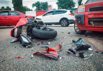 Motorcycle crashes on a vehicle.