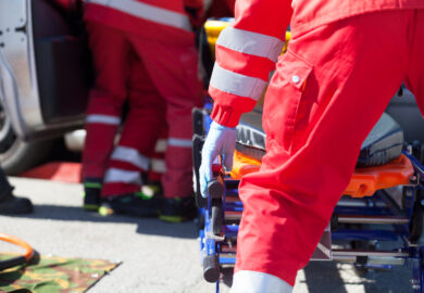 Paramedics holding a stretcher.