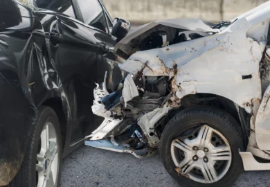 Wrecked white and black car.