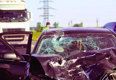 Car after a head on crash accident with a truck.