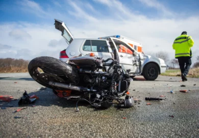 Collision between a motorcycle and a car.