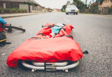 Red stretcher on the road.