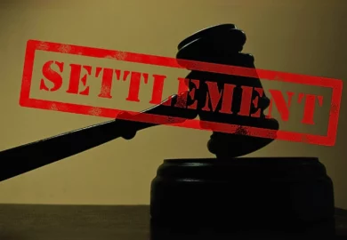 Settlement stamped and a wooden gavel on the background. average truck accident settlement