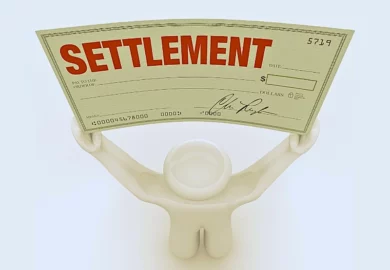 A man holds a large settlement check that he has won in a trial in civil court proceedings. average Hydroxycut settlement