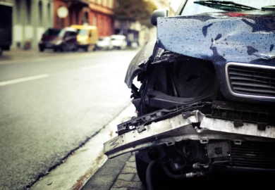 Wrecked blue car after a severe car crash.