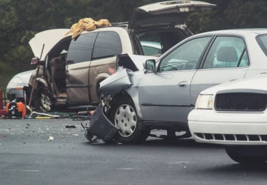Multiple vehicle car crash along the highway.