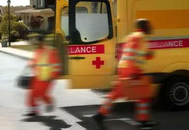 Paramedics rushing to rescue injured people from an accident.